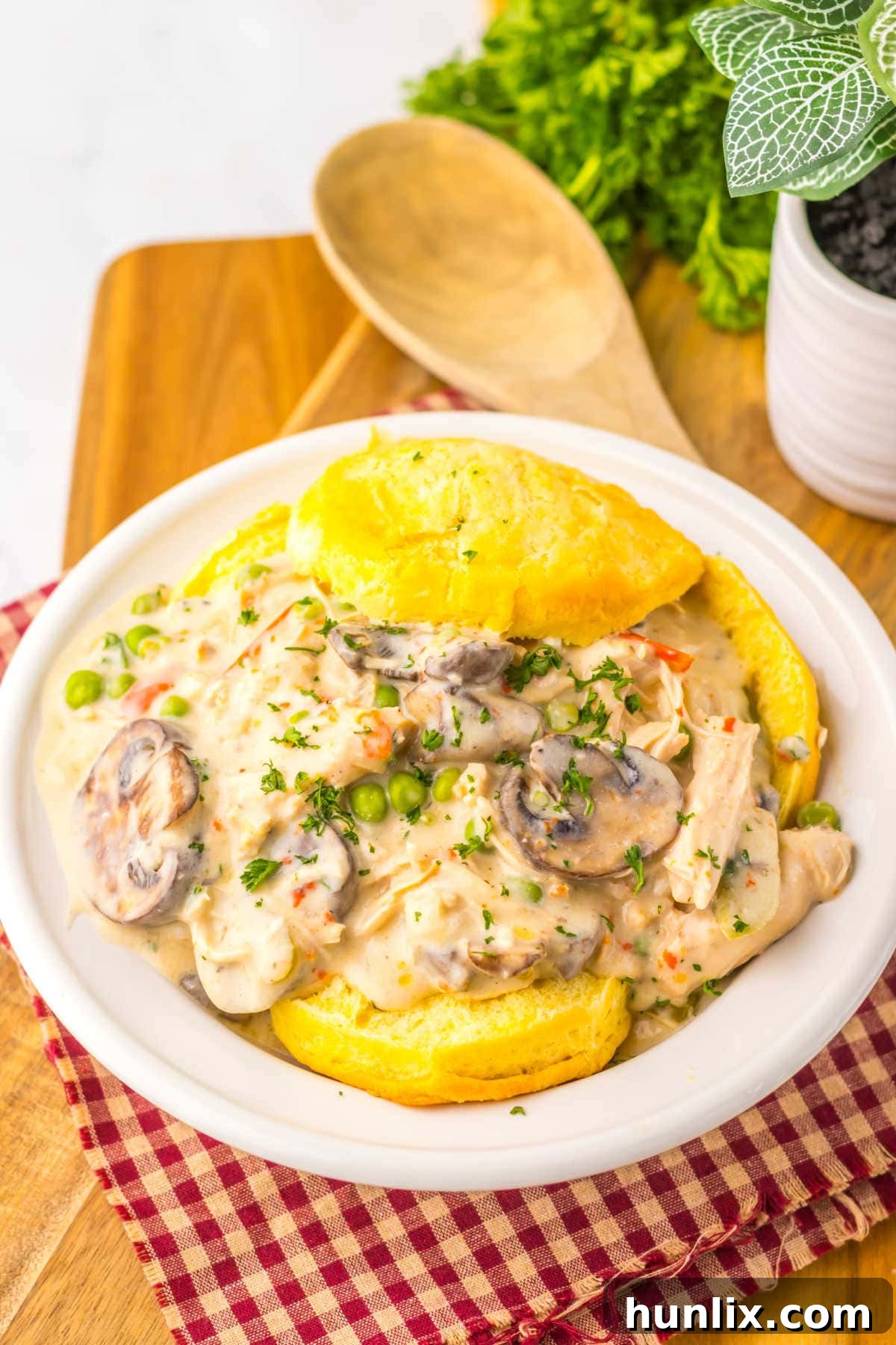 Effortless Slow Cooker Turkey a la King 6 The recipe over biscuits on a plate.