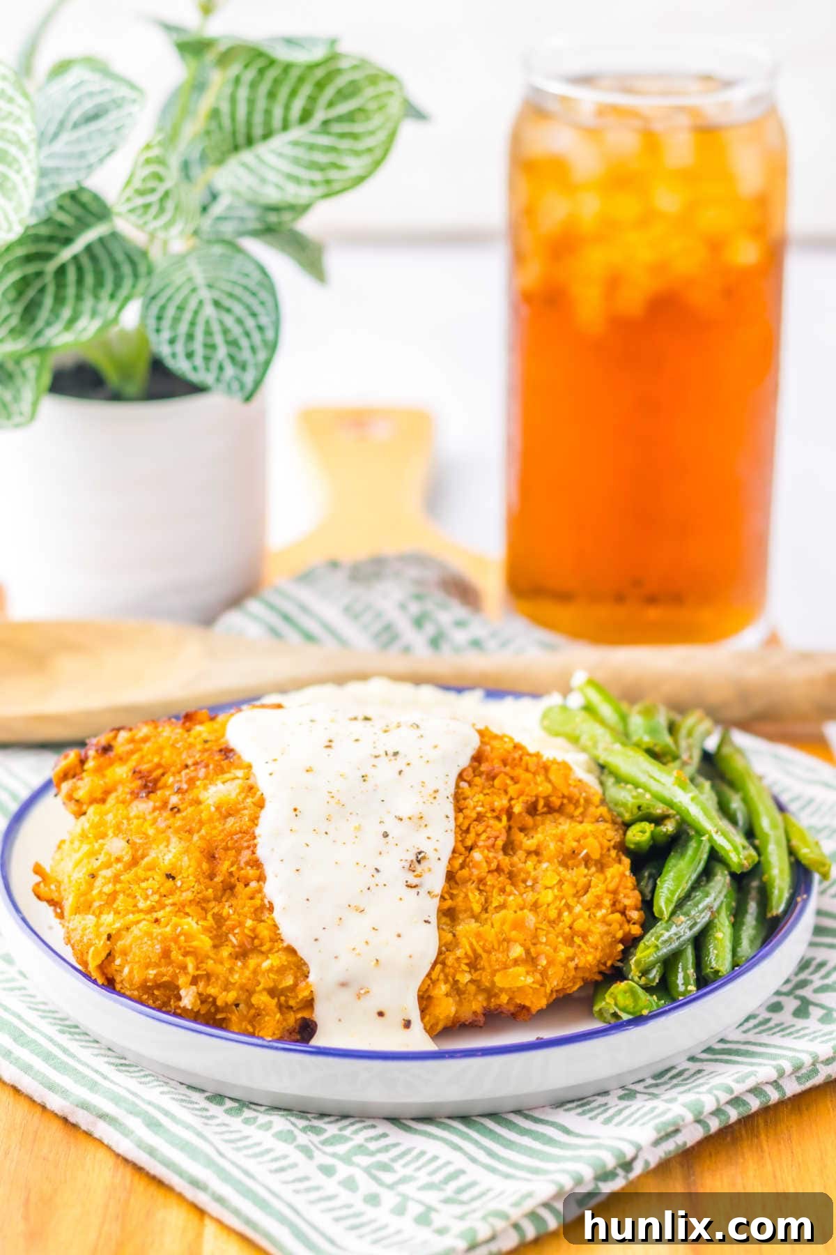 Cracker Barrel Chicken Fried Steak on a plate with green beans.