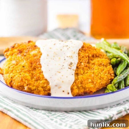 The recipe on a plate with green beans.