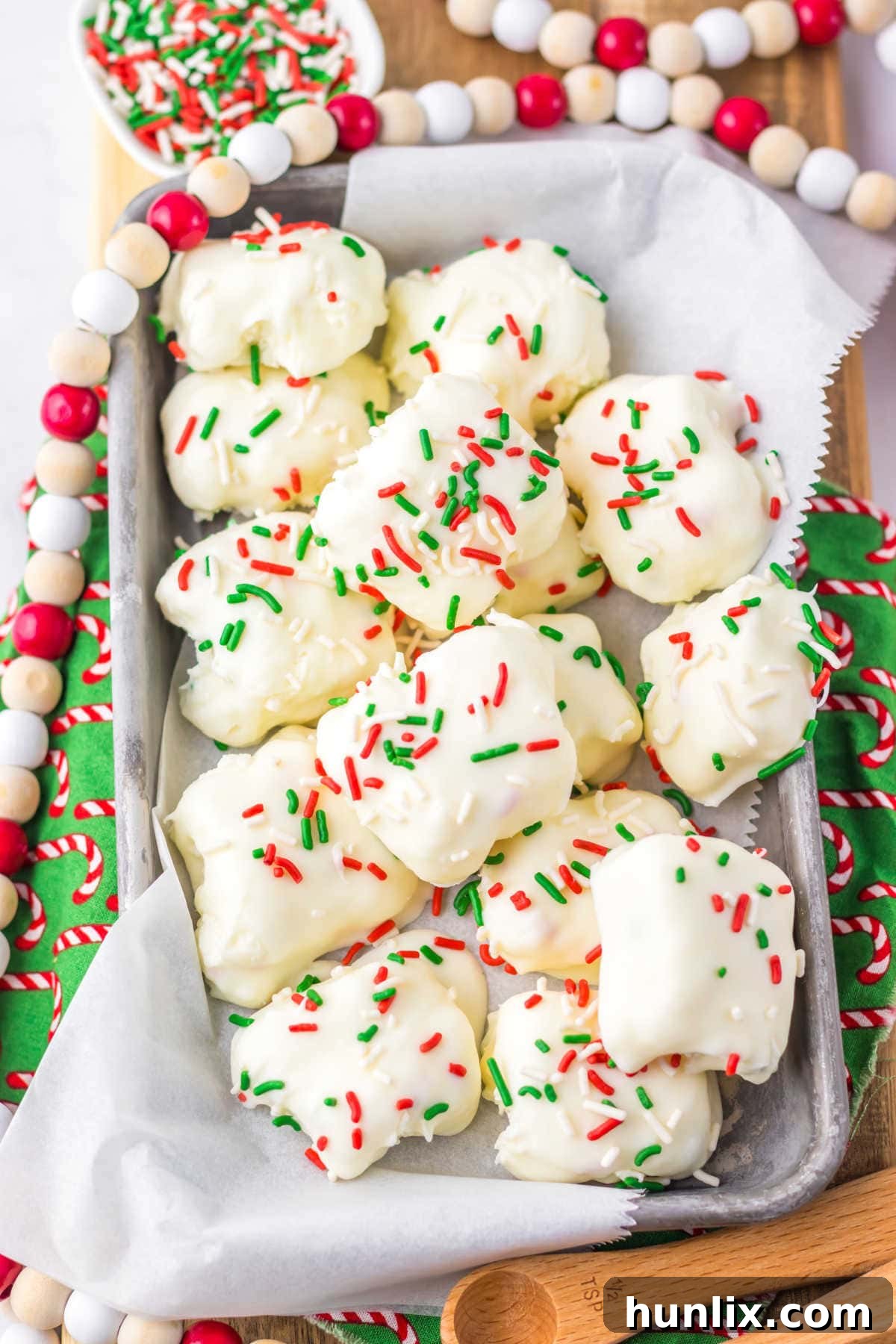 The Cool Whip Candy recipe presented on a baking tray, surrounded by festive Christmas decorations.