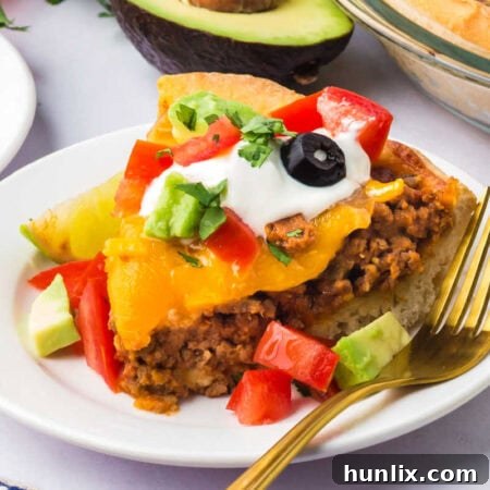 A slice of the recipe on a plate with a fork.