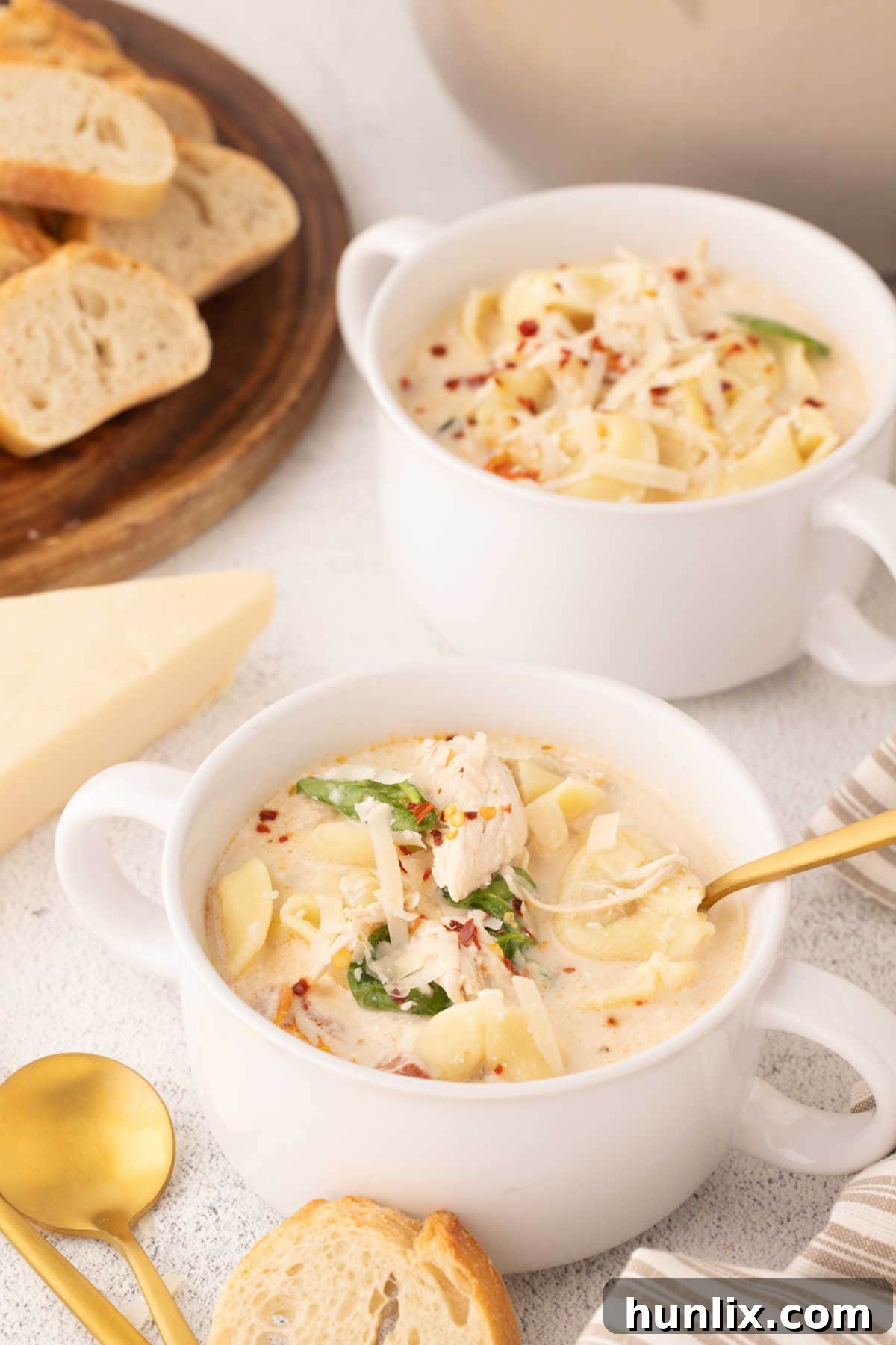 Soulmate Chicken Soup 2 A bowl of Marry Me Chicken Soup, garnished with fresh herbs and Parmesan.