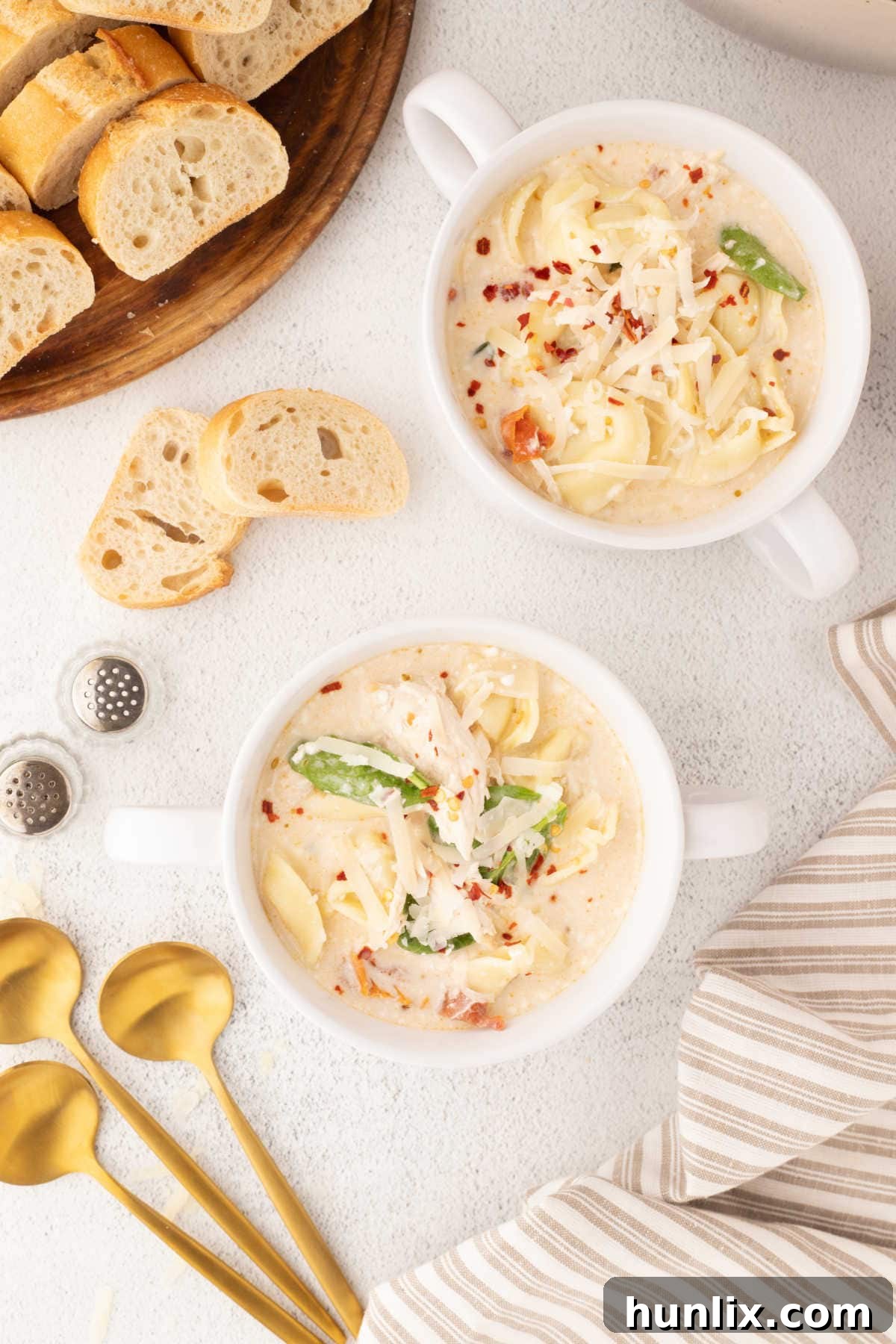 Soulmate Chicken Soup 8 Multiple bowls of Marry Me Chicken Soup arranged neatly on a white background, ready for serving.