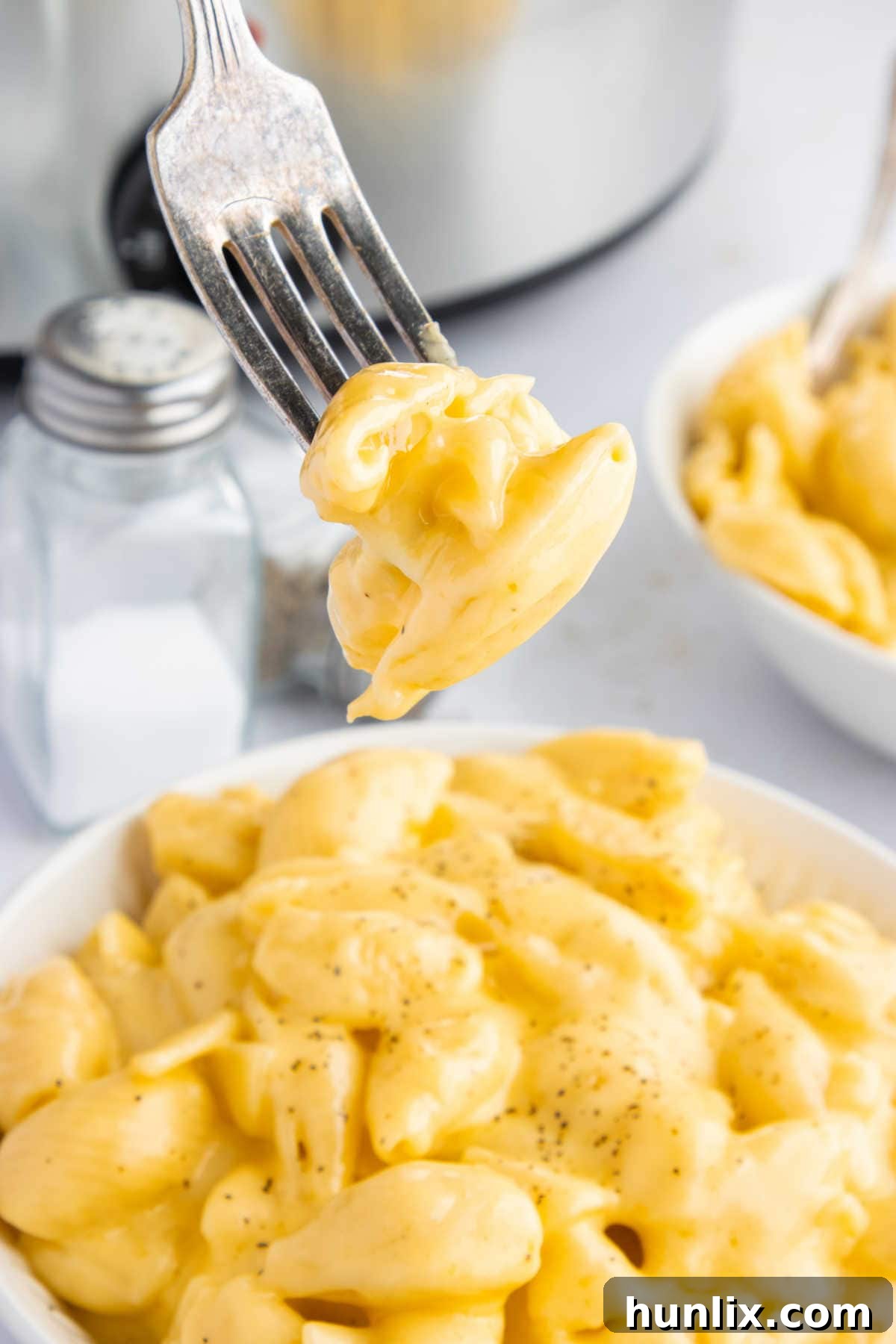 Creamy Slow Cooker Velveeta Mac and Cheese 7 The recipe on a fork.