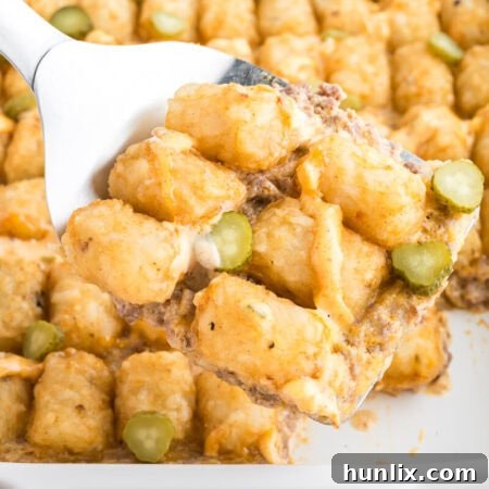 Loaded Big Mac Tater Tot Casserole 11 A close-up shot of the Big Mac Tater Tot Casserole slice, showing crispy tots and cheesy beef.