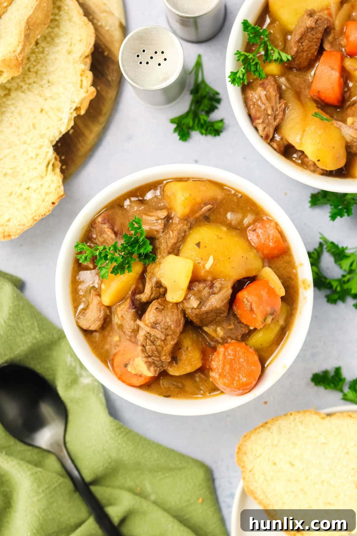 A bowl of Slow Cooker Guinness Irish Beef Stew ready to be enjoyed, showing its hearty ingredients.