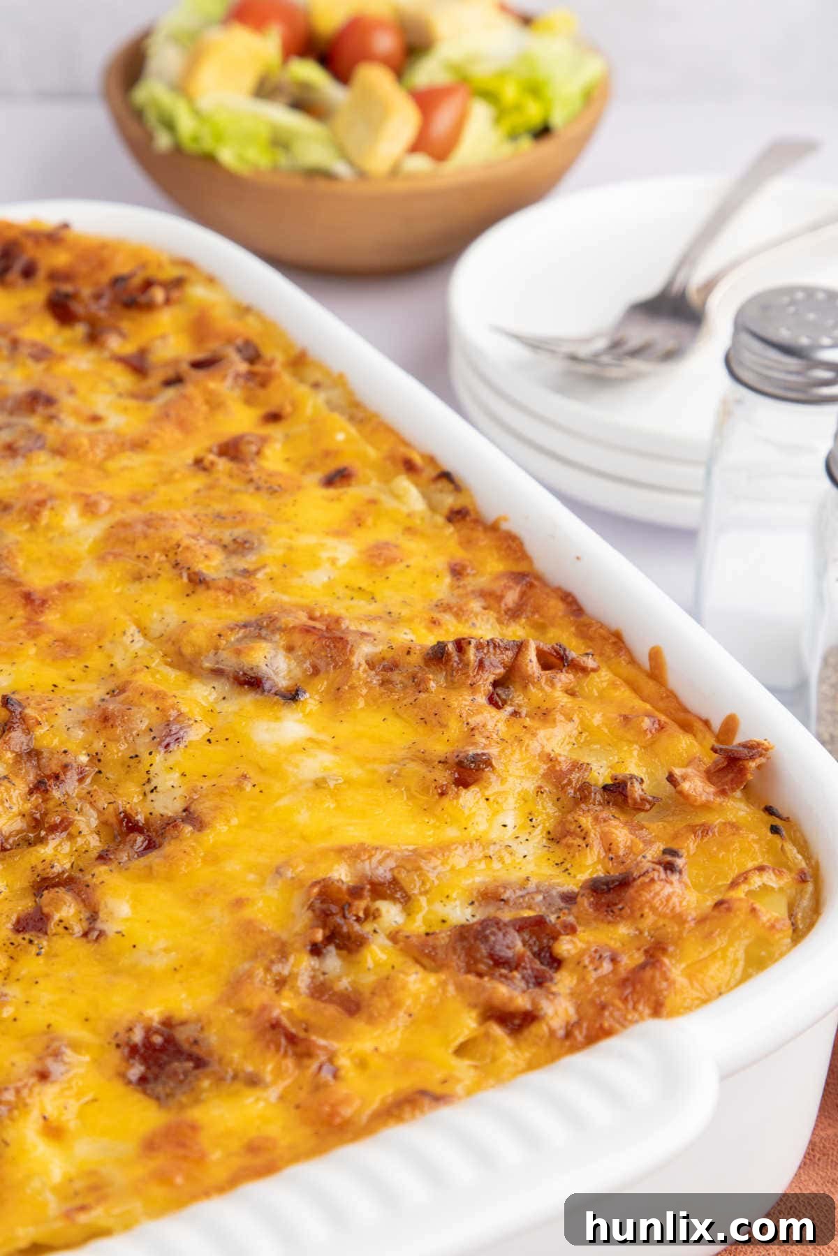 A pan of pierogi lasagna, golden and bubbly, fresh out of the oven.