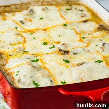 The finished Chicken Gloria in a red casserole pan.