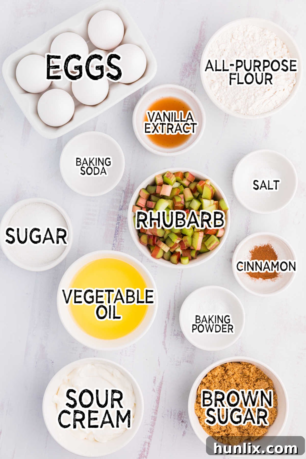 Tangy Rhubarb Loaf 3 Ingredients for Rhubarb Bread laid out on a white background, including flour, sugars, oil, sour cream, and fresh chopped rhubarb.