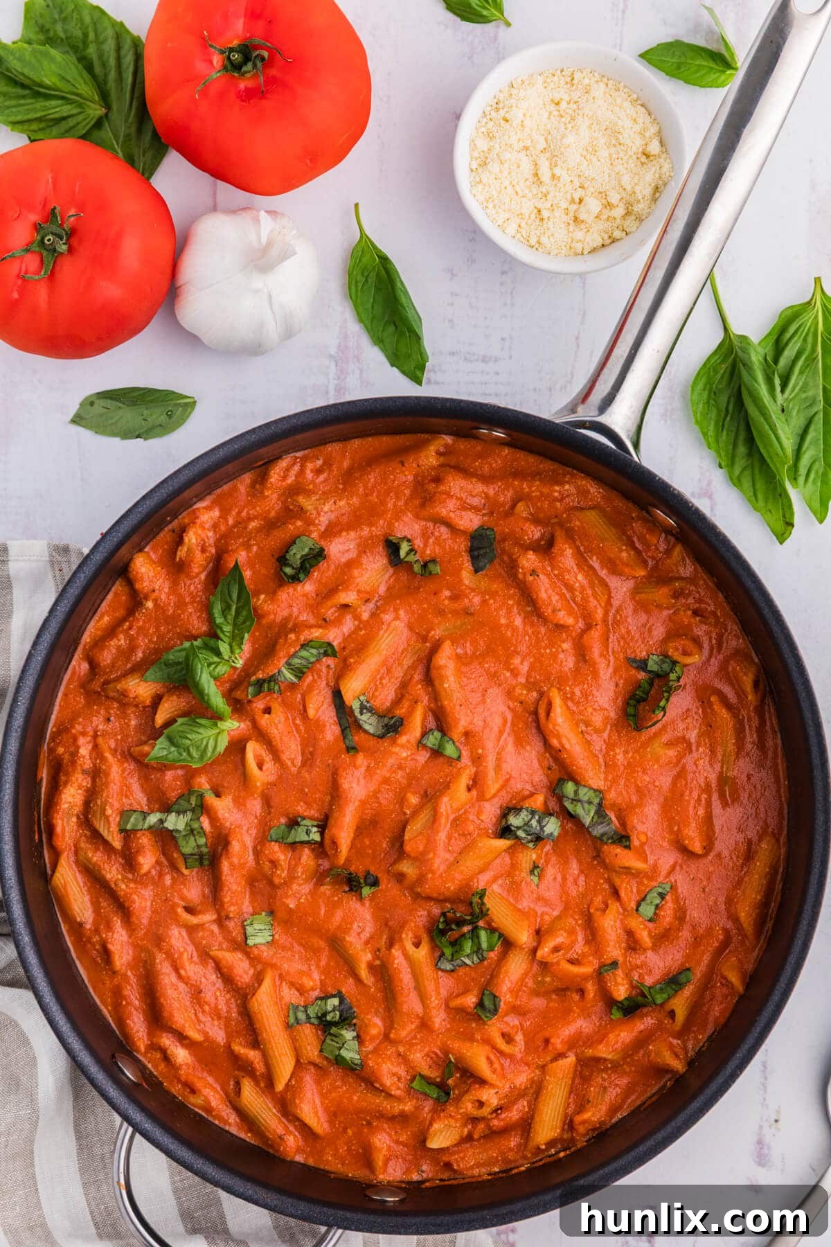 A vibrant One-Pot Creamy Tomato Pasta dish, perfectly cooked and served in a skillet, ready to be enjoyed as an easy weeknight meal.