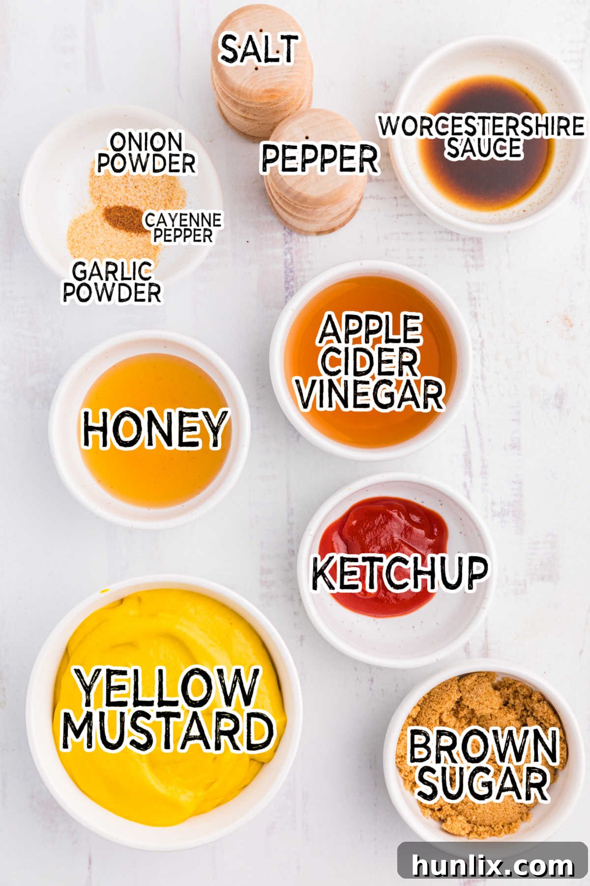 Collection of fresh ingredients for Carolina Mustard BBQ Sauce laid out on a white background.