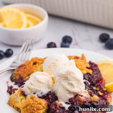 The recipe on a plate topped with vanilla ice cream.