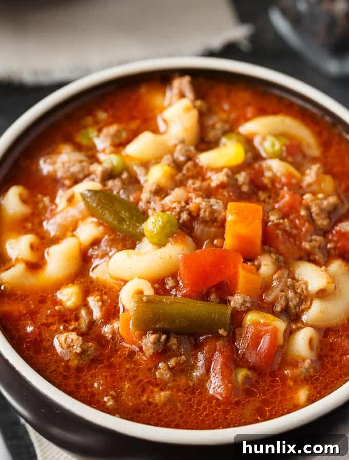 Comfort in a Bowl: Soups and Stews for Cold Days 3 A bowl of Busy Day Soup garnished with fresh parsley.