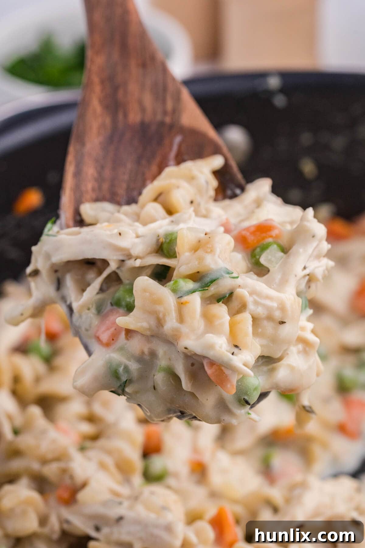 A scoop of the recipe on a wooden spoon.