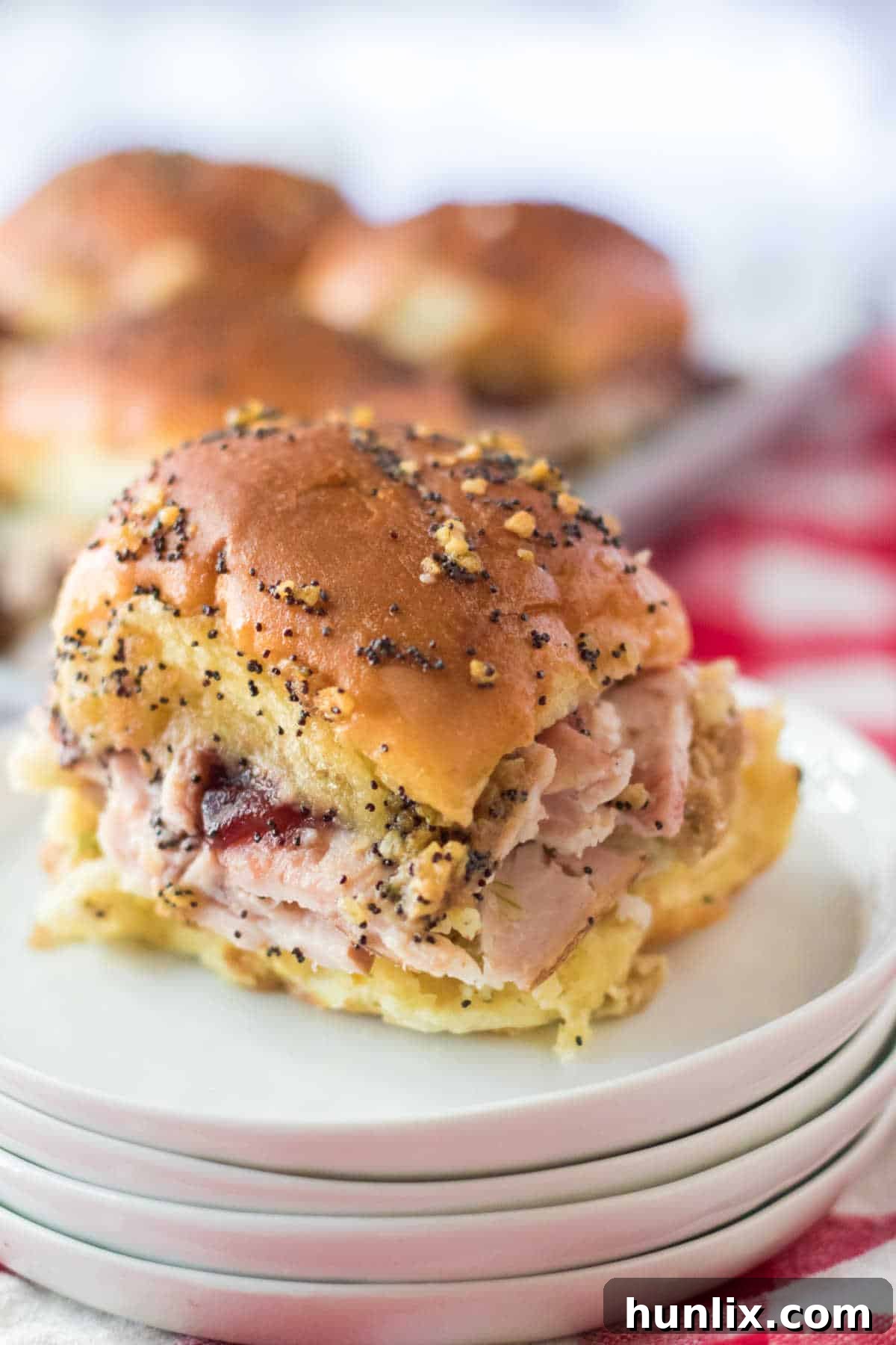 Thanksgiving sliders made with leftover turkey, stuffing, and cranberry sauce.