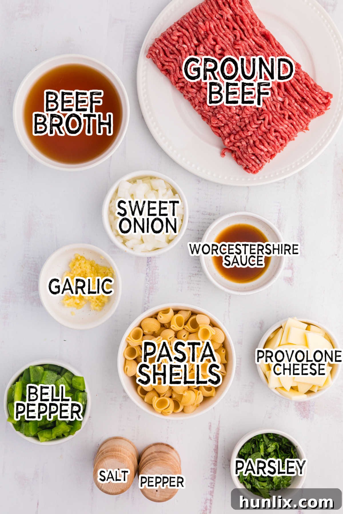 Cheesesteak Noodle Skillet 3 Ingredients for Philly Cheesesteak Pasta on a white background.