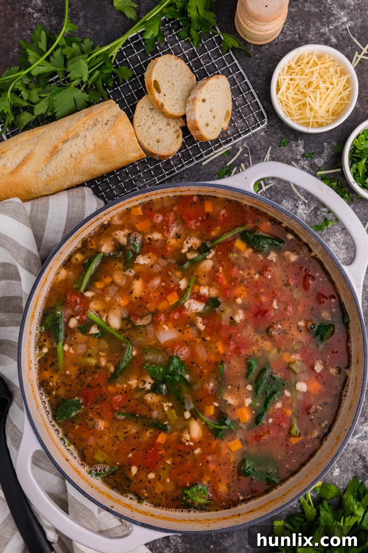 A pot of White Bean and Sausage Soup, ready to be served.