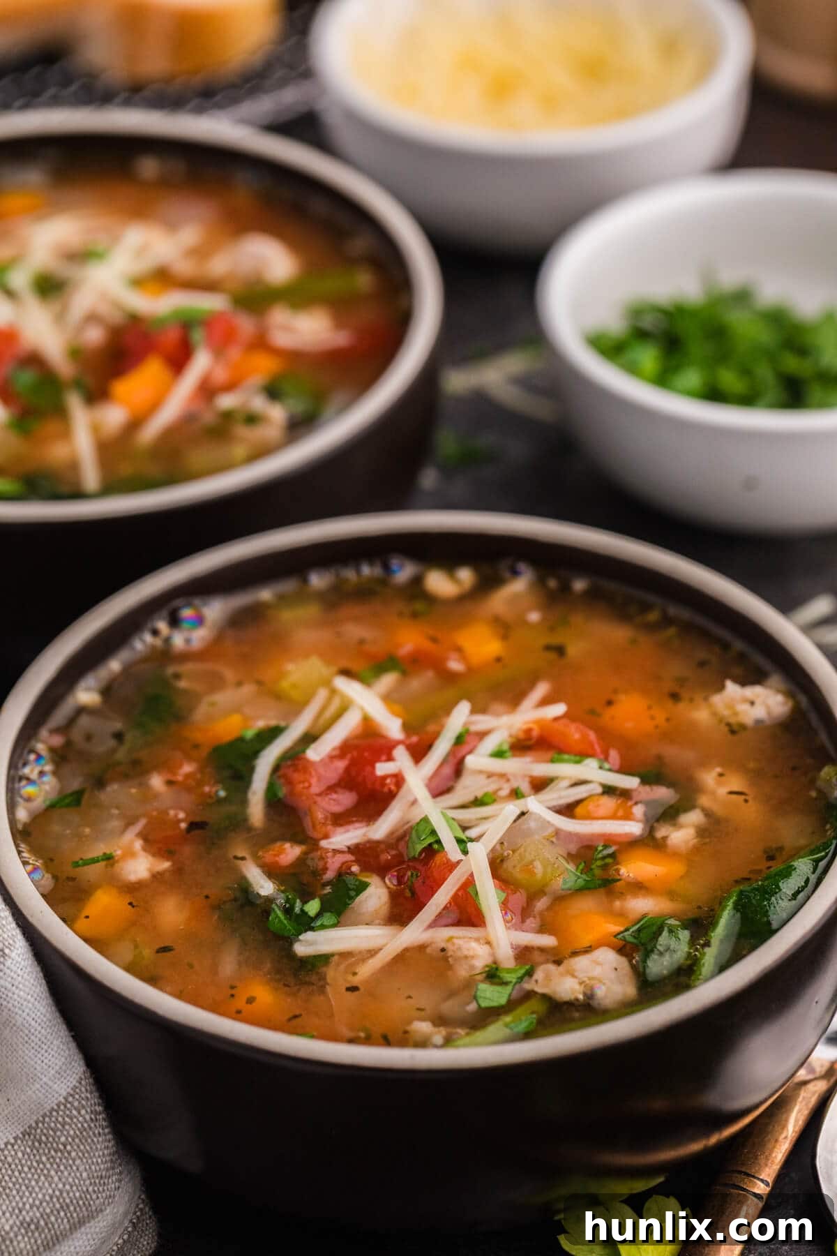 A freshly served bowl of White Bean and Sausage Soup.