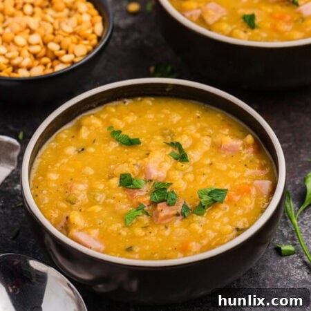 The finished split pea soup in a black bowl, ready to serve.