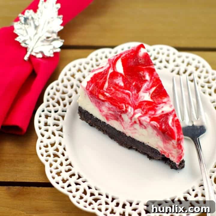 A vibrant No Bake Rhubarb Cheesecake with an Oreo crust and a marble filling, ready in 30 minutes.