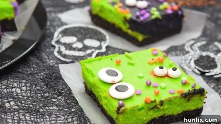 Creamy vanilla cheesecake with Halloween color swirls.