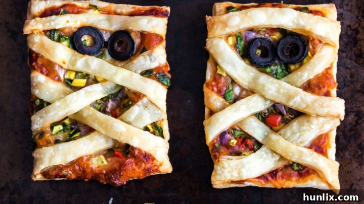 Yummy and healthy Halloween themed Mummy Pizza made from puff pastry.