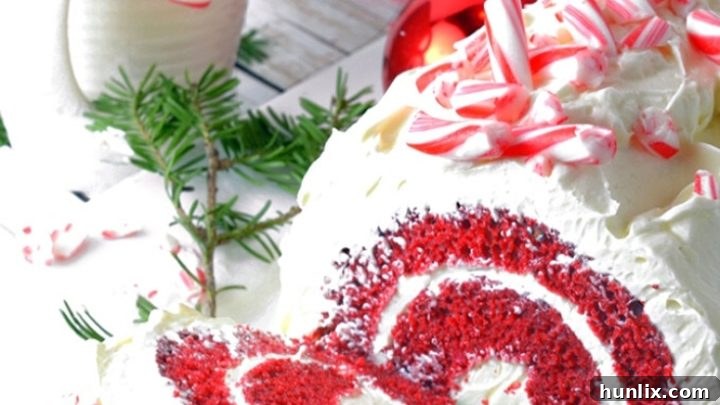 A beautiful Red Velvet Cake Roll featuring a rich chocolate and peppermint buttercream frosting, perfect for any celebration year-round.