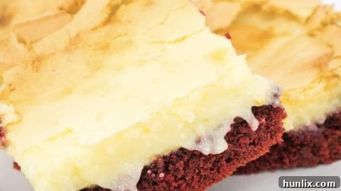 Easy Red Velvet Ooey Gooey Butter Cake, a fun twist on the classic, starting with a cake mix for a simple dessert perfect for a crowd.
