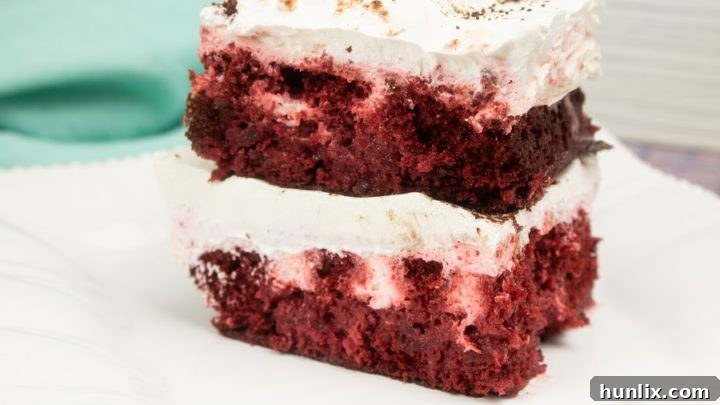 Dreamy, fluffy, and luscious Red Velvet Poke Cake, hailed as the best dessert for any occasion, offering rich flavor and moist texture.