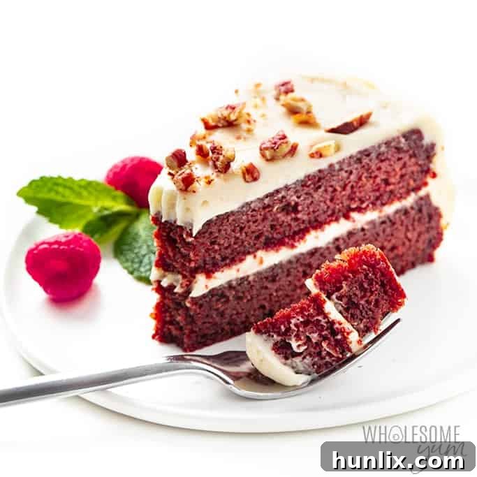 Moist and rich Keto Red Velvet Cake, naturally colored, with only 3.4g net carbs per slice, ready in an hour for a sugar-free, low-carb treat.
