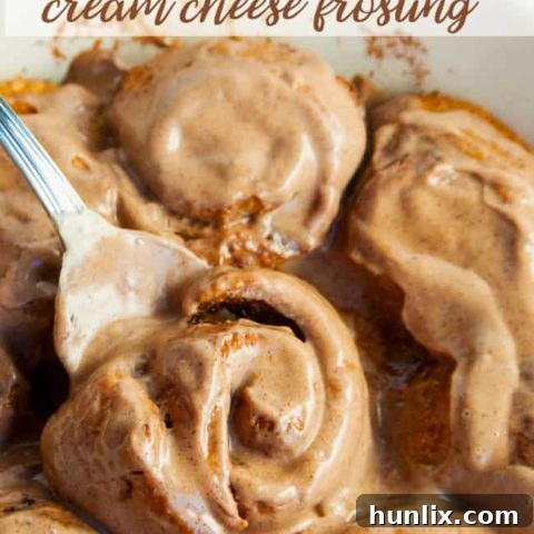 Warm Cinnamon Rolls with festive Gingerbread Cream Cheese Frosting