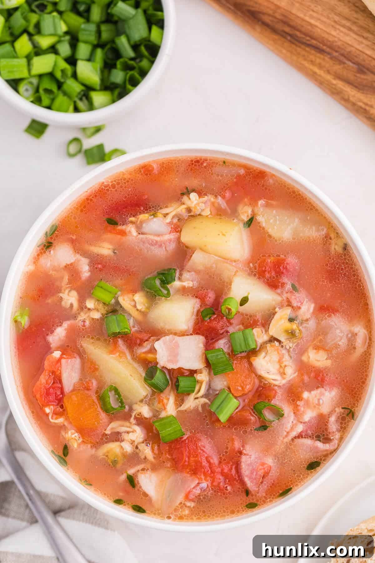 Manhattan Tomato Clam Chowder 7 An overhead view of a bowl of soup.