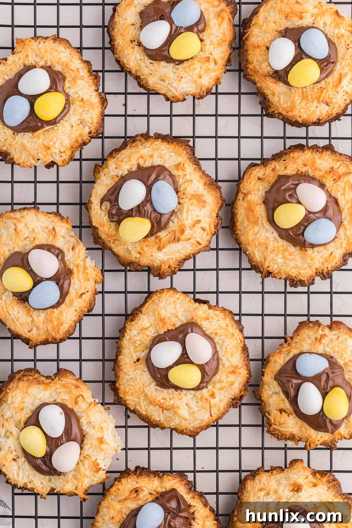 Coconut Macaroon Nutella Cookie Nests on a cooling rack, freshly baked and ready for decoration.