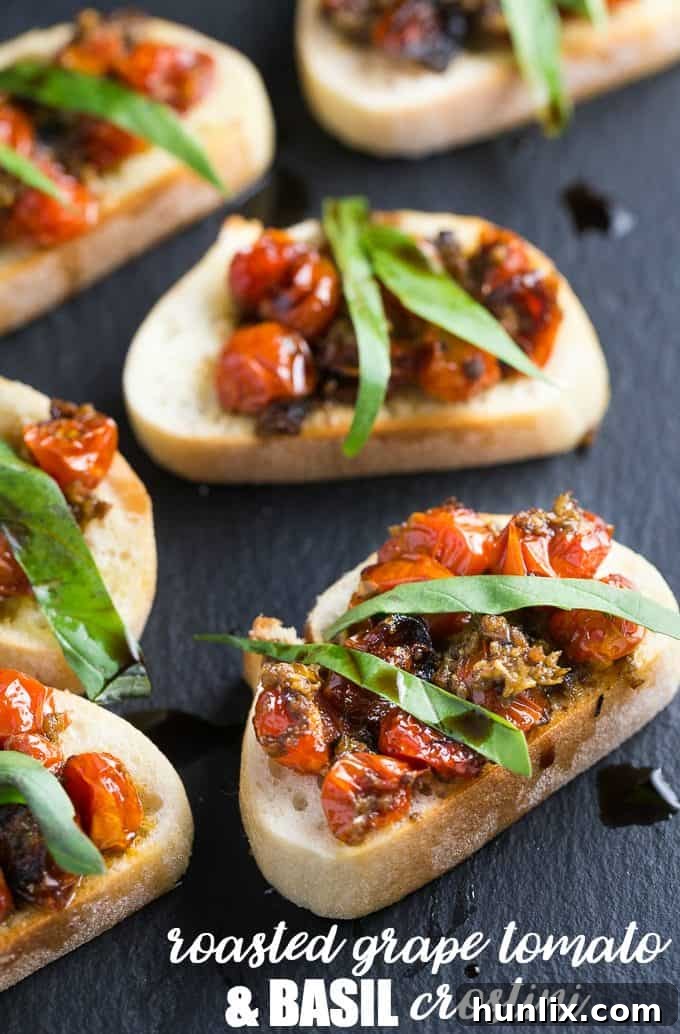 Roasted Grape Tomato and Basil Crostini - A toasted baguette is topped with grape tomatoes roasted in garlic and olive oil and finished off with ribbons of fresh basil and a drizzle of balsamic vinegar.