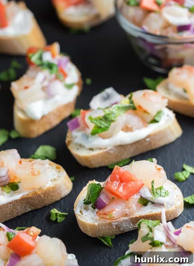 Zesty Shrimp Flatbred - Tantalize your tastebuds with this appetizer. Tzatziki, mint and jalapenos collide to kick the zing up on this shrimp recipe. 