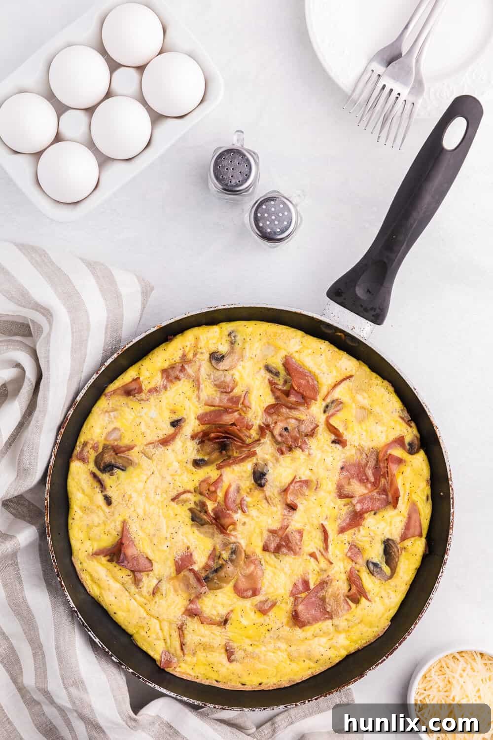 Hearty Turkey Bacon Frittata 2 Savory Turkey Bacon Frittata with mushrooms and onions, sliced and ready to serve. Perfect for a healthy breakfast or light dinner.