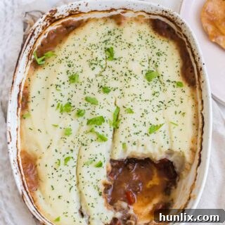 Beef Picadillo Shepherd's Pie with a piece cut of of it.