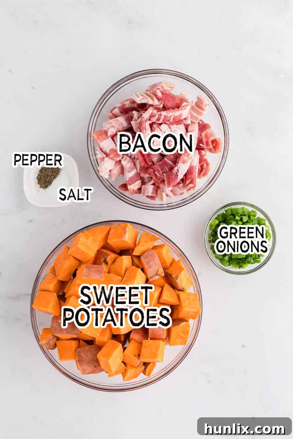 Ingredients for sweet potato home fries laid out on a cutting board.