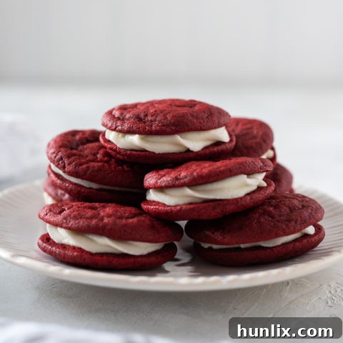 Soft and chewy Homemade Red Velvet Sandwich Cookies with luscious cream cheese frosting, perfect for Valentine's.