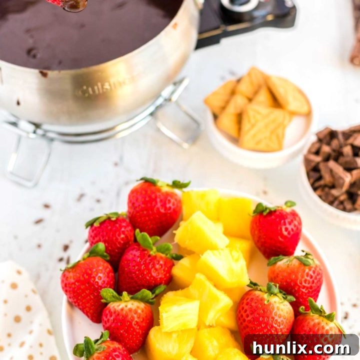 Velvety Easy Chocolate Fondue, rich, decadent, and made with only four ingredients in 15 minutes.