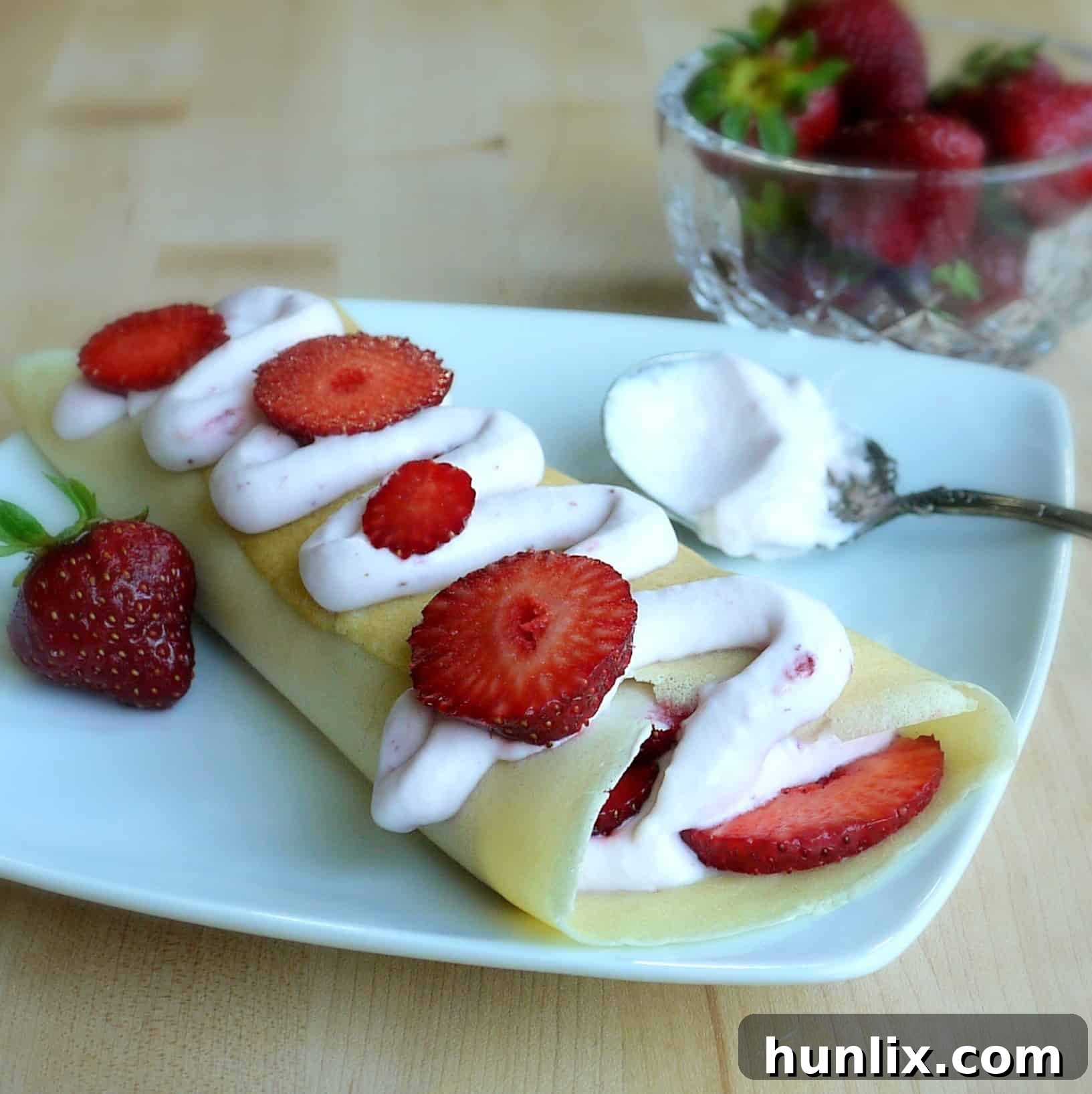 Light and creamy Fresh Strawberry Crêpes, perfect for a romantic brunch or elegant dessert.