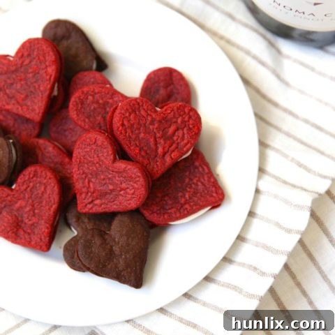 Heart-shaped Red Velvet Sandwich Cookies, a festive and beautiful Valentine's Day treat.