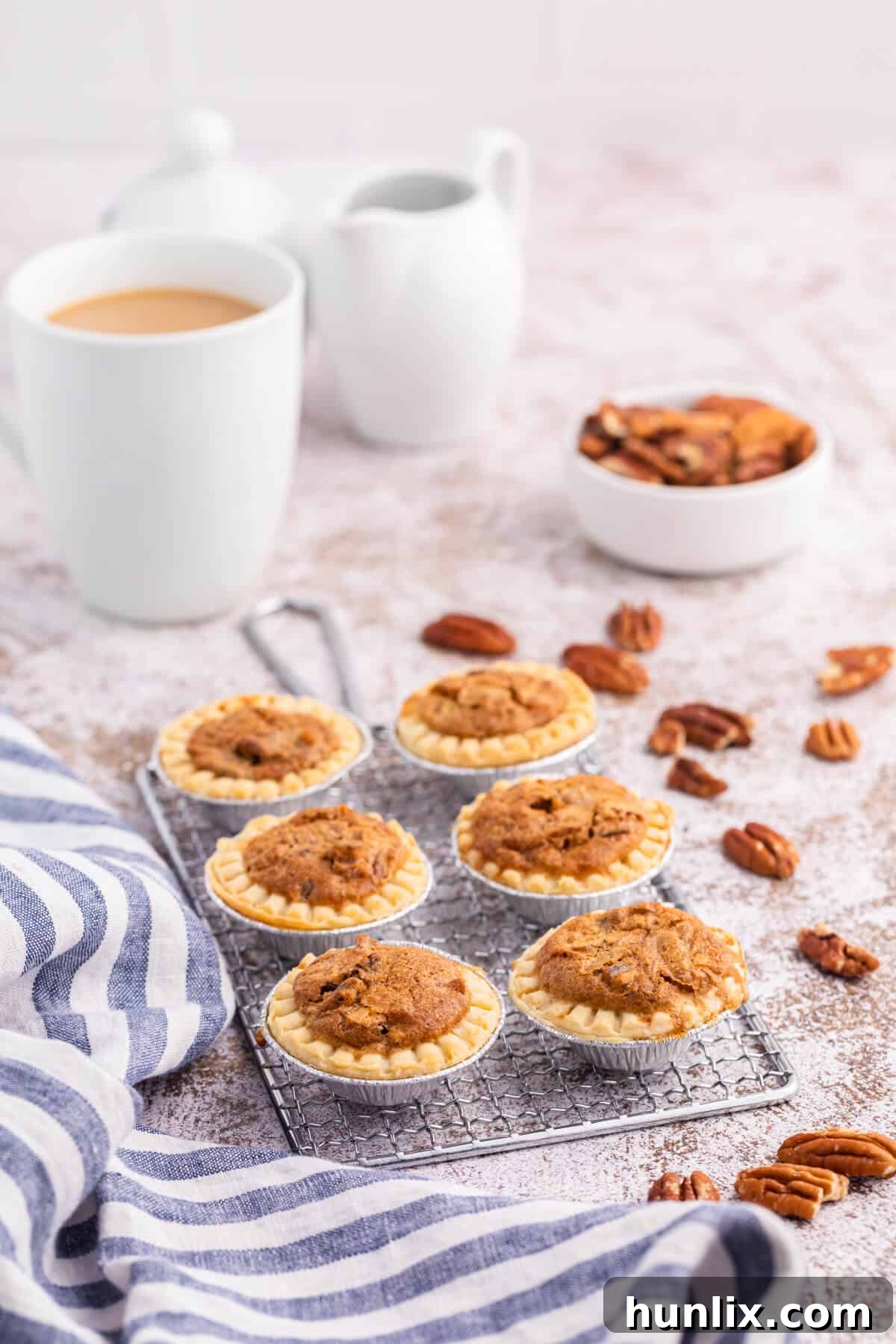 Golden Pecan butter tarts cooling on a wire rack.