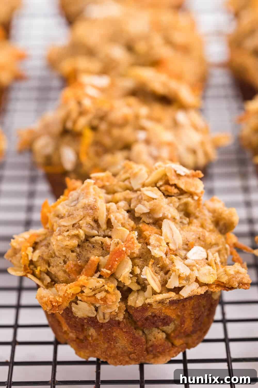 Double Orange Muffins - Healthy and delicious muffins with carrots, orange juice, oat bran, flax seed, Greek yogurt and more. Perfect for make-ahead breakfasts!