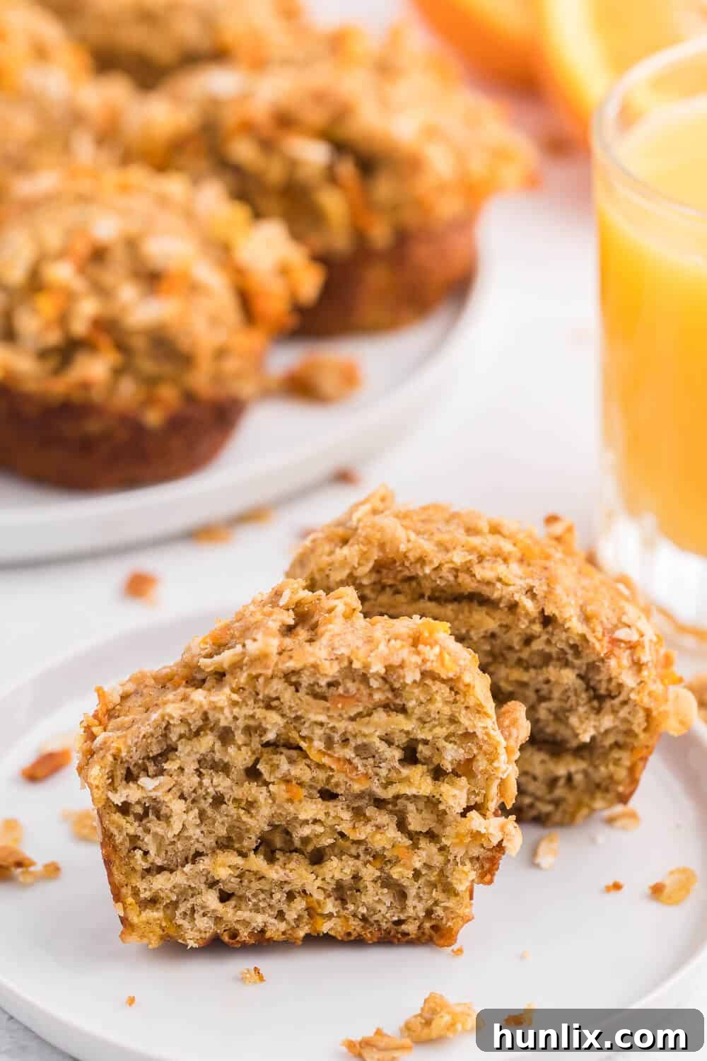Double Orange Muffins - A stack of freshly baked muffins with streusel, ready to be enjoyed. Highlights the texture and inviting presentation.