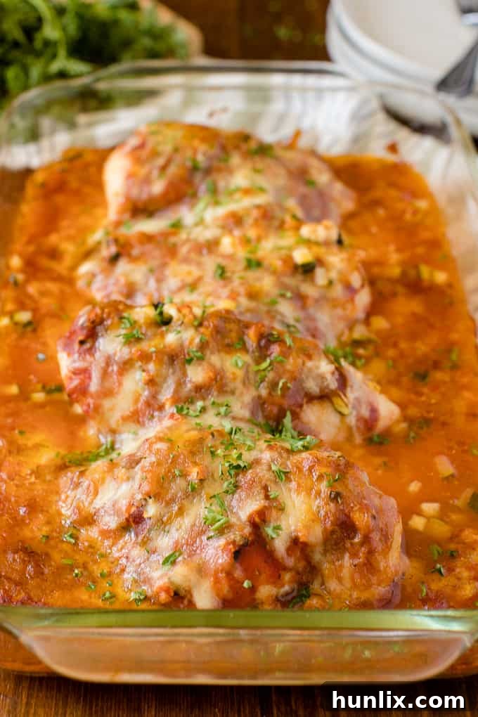 Homestyle Chicken Parmesan Bake 2 A delicious baked chicken parmesan in a casserole dish, ready to be served.