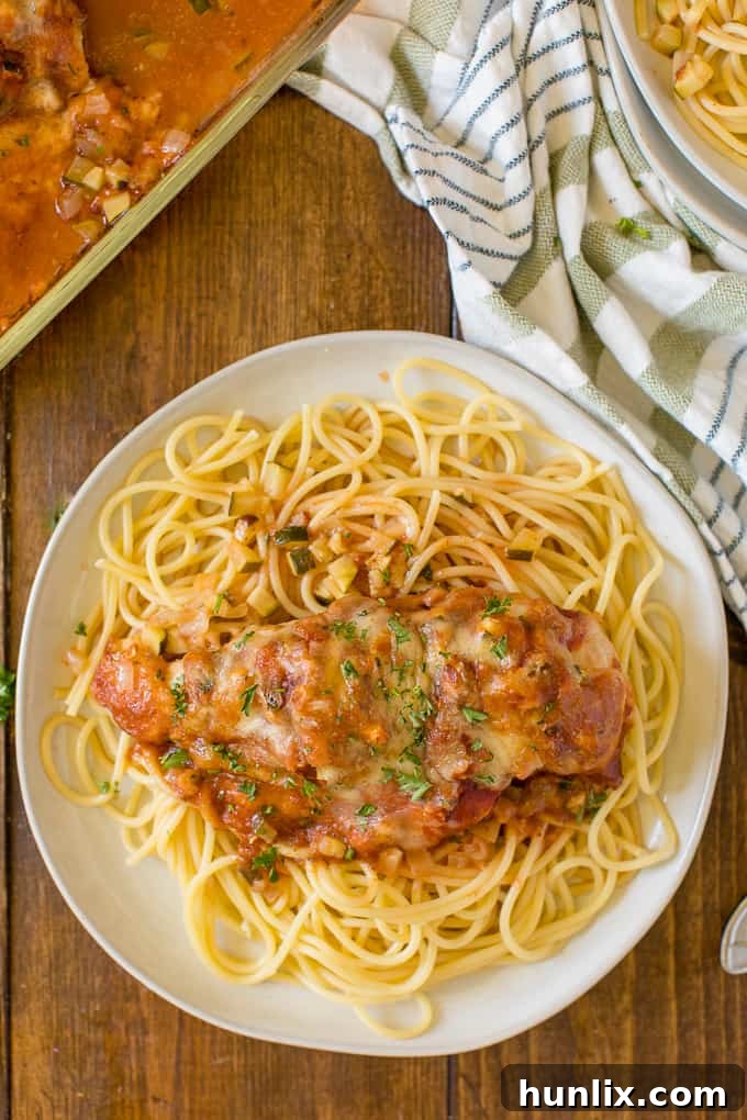 Homestyle Chicken Parmesan Bake 10 A large baking dish filled with multiple servings of baked chicken parmesan.