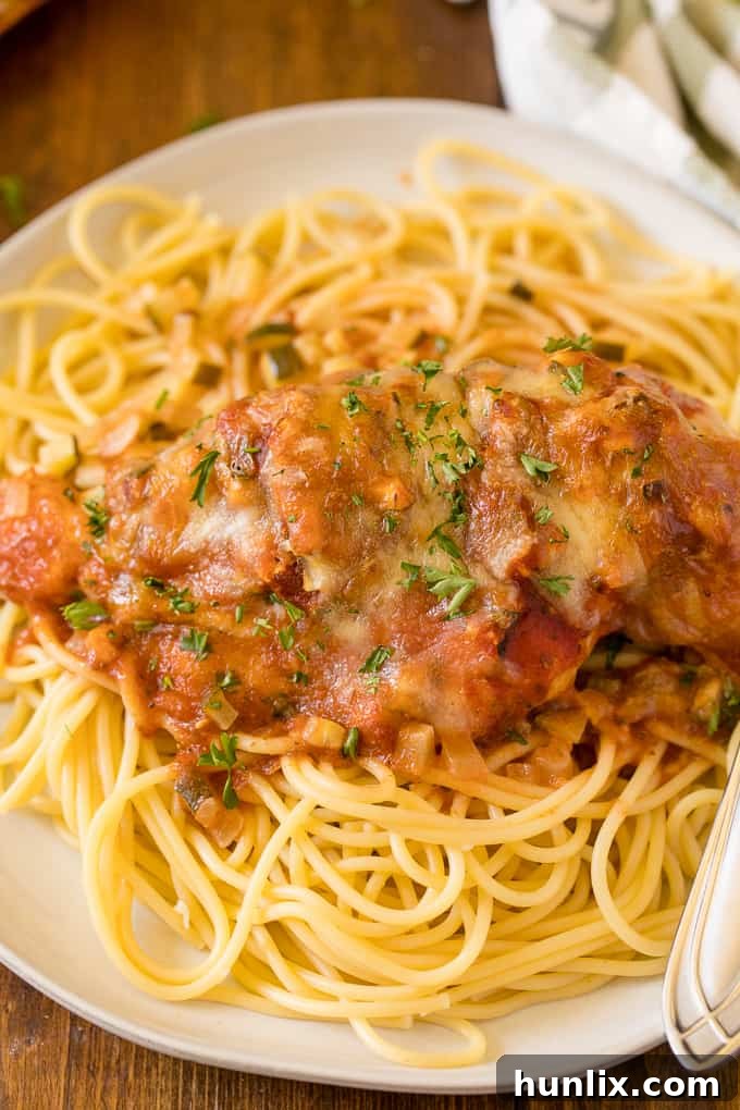 Homestyle Chicken Parmesan Bake 14 Various kitchen tools like a skillet, baking dish, tongs, and mixing bowls.