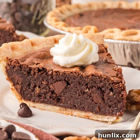 A delectable slice of Brownie Pie on a plate, ready to be enjoyed.