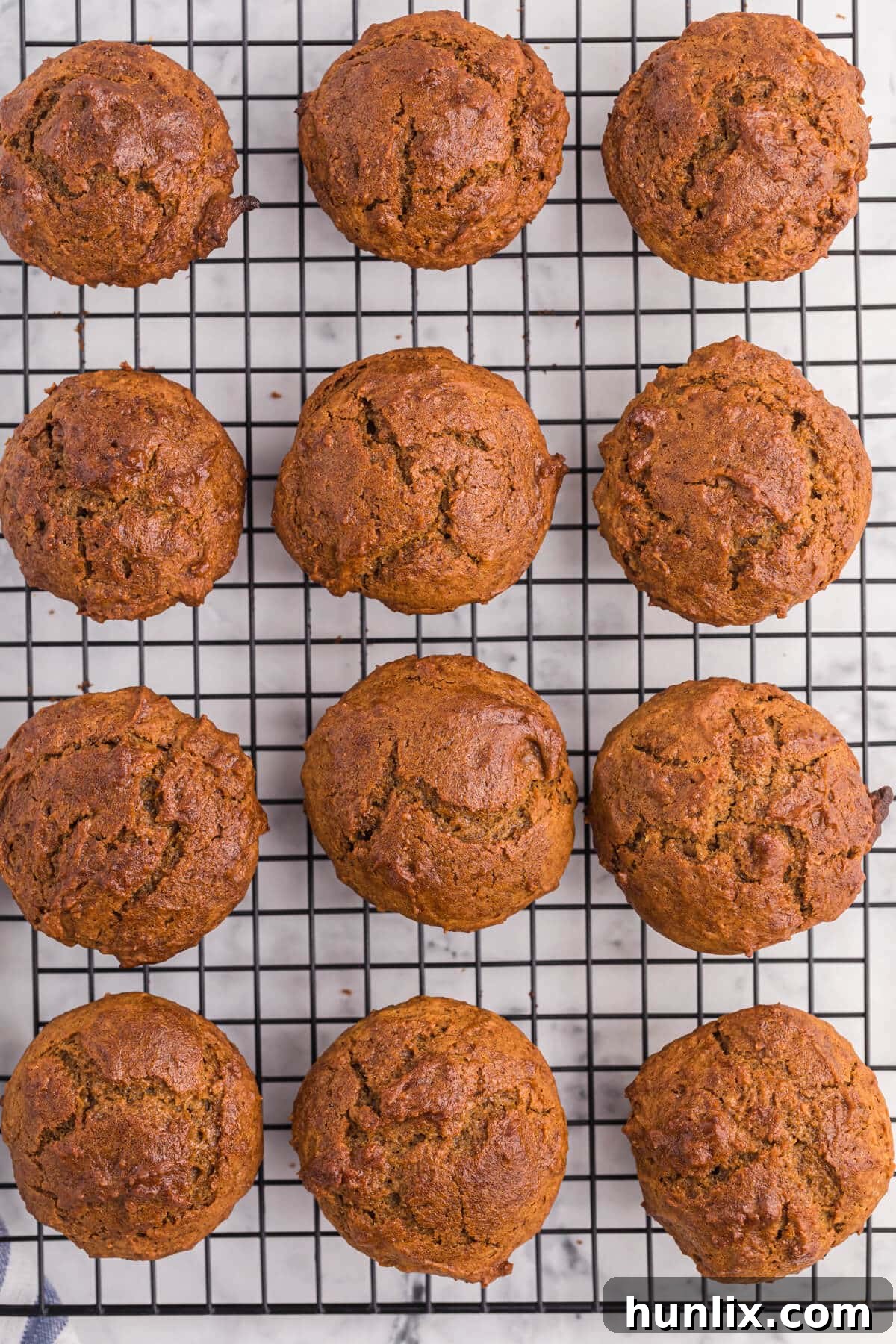 Sweet potato muffins on a wire baking rack, ready to be enjoyed.